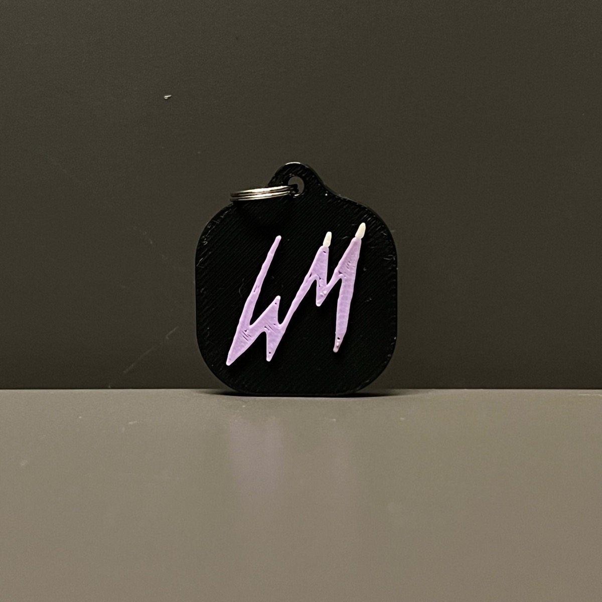 Black and purple WM keychain